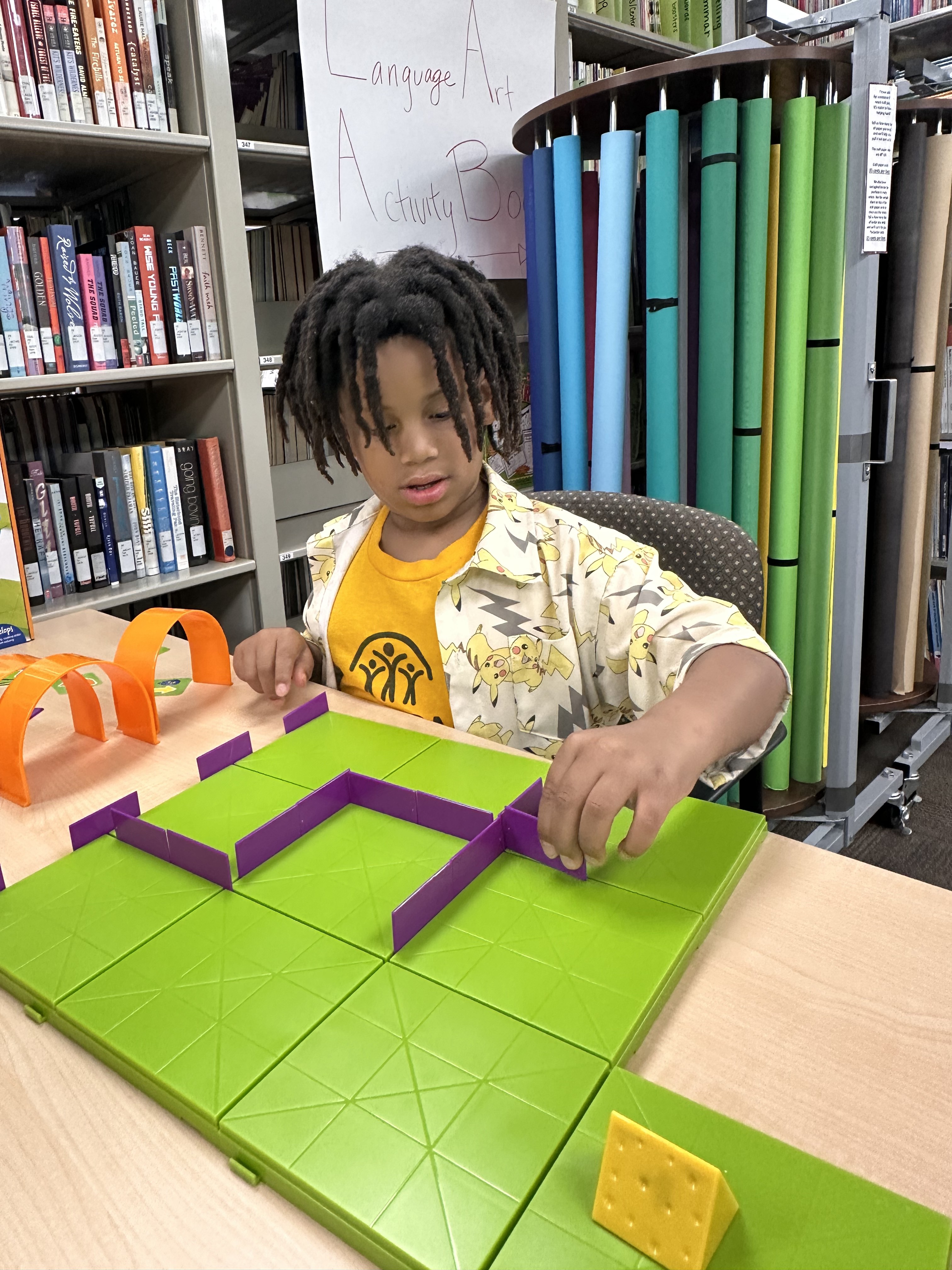Image: Child playing with different sized blocks to learn math concepts during KSU's Horizons Atlanta summer learning program.